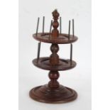 19th Century turned revolving cotton reel stand, the two central rotating discs each with six