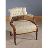 Edwardian nursing chair with an upholstered seat and back with a pierced back with marquetry