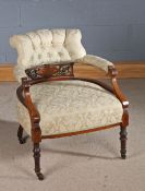 Edwardian nursing chair with an upholstered seat and back with a pierced back with marquetry