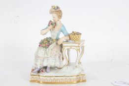 Meissen porcelain figurine, in the form of a seated lady in 18th century dress, marks to base,