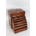 20th Century mahogany dentists cabinet, with hinged compartment above six drawers, with contents,