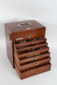 20th Century mahogany dentists cabinet, with hinged compartment above six drawers, with contents,