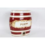 Large early 20th century ceramic pun barrel "Port", with maroon bands on a white ground, 27cm