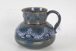 Doulton Lambeth jug, the blue ground with floral garland decoration, 16cm high