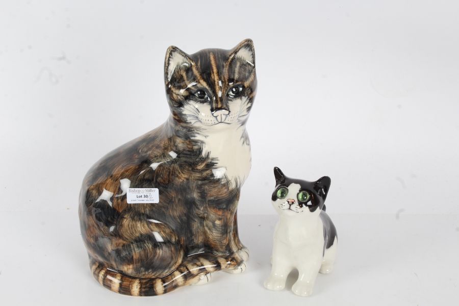 Winstanley pottery cat, in black and white with green glass eyes, 14cm high, together with one other