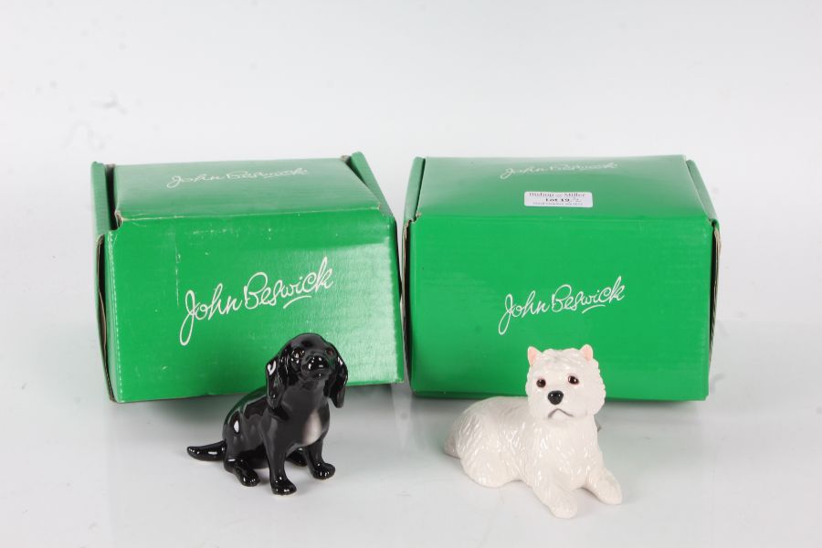 Two Beswick porcelain dogs, Cocker Spaniel pup, and a Westie, both boxed (2)