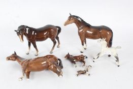 Beswick horse in brown with white feet and head,together with four others (some AF) largest 24cm