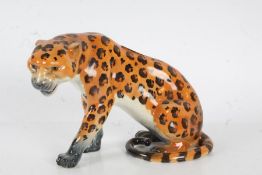 A Beswick figure modelled as a seated leopard model No 841, 17.5cm high 26cm wide repair to tail