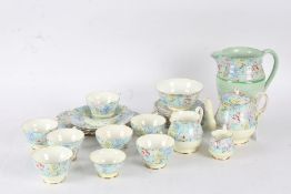 Shelley "Melody" part teaset, comprising teapot, two cream jugs,one large jug, two sugar bowls,