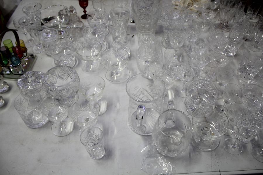 Large quantity of mostly cut glass ware, to include tumblers, vases, champagne saucers, sherry