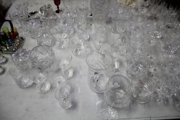 Large quantity of mostly cut glass ware, to include tumblers, vases, champagne saucers, sherry