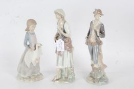 Two Lladro figures together with a Nao figurine depicting a girl with a swan, largest 29.5cm high