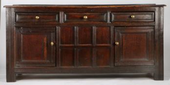 18th Century and later oak dresser base, the rectangular top above three short drawers and two