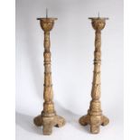A large pair of Regency pricket sticks, the spike tops above acanthus leaf carved columns and a