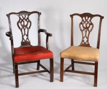 George III style mahogany armchair and single chair, the arched top rail with carved tassels above