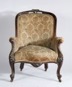 Victorian mahogany armchair, the carved foliate top rail and button back above the serpentine