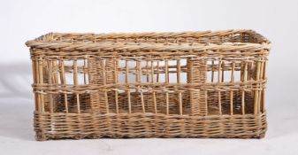 A large wicker log basket, of rectangular form, 97cm long, 55cm deep, 41cm high