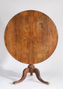 Victorian rosewood breakfast table, the circular top above a turned column and acanthus leaf
