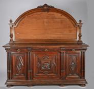 Victorian mahogany sideboard, the arched back with shield and foliate carved pediment and with
