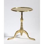 Victorian miniature polished brass tilt-top table, the circular top raised on a stepped stem and