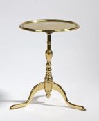 Victorian miniature polished brass tilt-top table, the circular top raised on a stepped stem and
