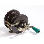 Penn No.85 multiplier fishing reel, the brown bakelite body with white metal fittings and green