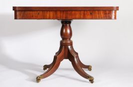 Regency mahogany tea table, the rotating D shaped fold-over top with reeded rim, the frieze with two
