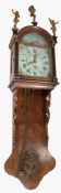 19th Century Dutch wall clock, surmounted by figures above the arched hood and drop case, the