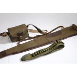 Brown leather and green canvas shotgun slip case, together with a brown leather and green canvas