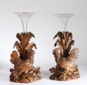 Pair of Black Forest style carved cockerel vases, the trumpet form glass vases with etched foliate