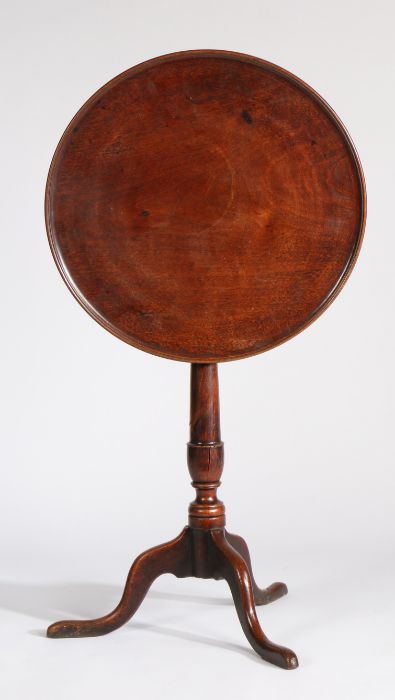 George III mahogany occasional table, the circular dished tilt top raised on a turned vase shaped