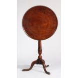 George III mahogany occasional table, the circular dished tilt top raised on a turned vase shaped