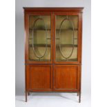 Edwardian mahogany and boxwood crossbanded display cabinet, the pair of astragal glazed doors