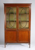 Edwardian mahogany and boxwood crossbanded display cabinet, the pair of astragal glazed doors