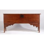 17th Century elm six plank coffer, the rectangular top above a panel front back and sides and shaped