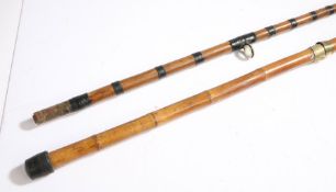 Early 20th Century bamboo sea fishing rod, with brass mounts and ceramic eyes, 342cm long
