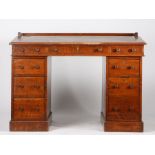 Victorian oak writing table, the tooled red leather inset writing slope opening to reveal a