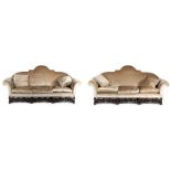 A good quality pair of William & Mary style settees, each settee with an arched stuff over