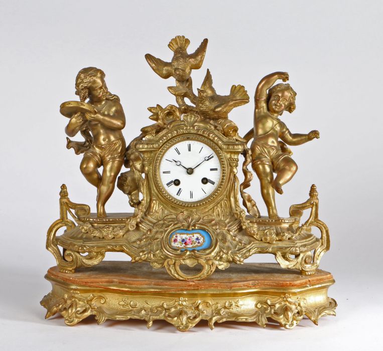 French gilt metal mantel clock, the case with dancing figures and birds surmounting a drum dial
