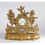 French gilt metal mantel clock, the case with dancing figures and birds surmounting a drum dial