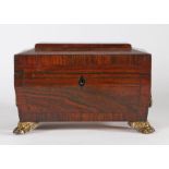 Regency rosewood tea caddy, of sarcophagus form with loop handles, the hinged lid opening to