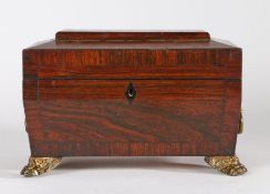 Regency rosewood tea caddy, of sarcophagus form with loop handles, the hinged lid opening to