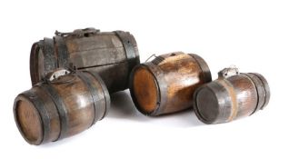 A collection of four 19th century oak costrels, each of typical barrel form and iron bound,  size