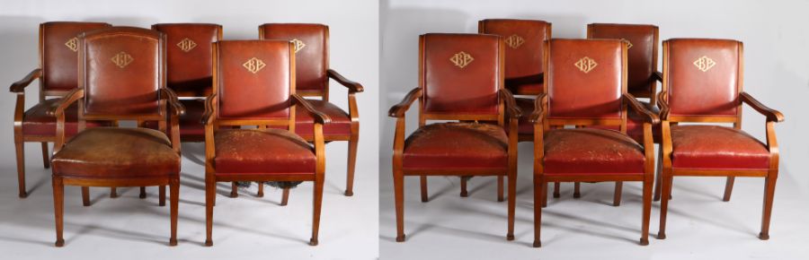 Ten Early 20th Century BP board room chairs, the brown leather back with embossed BP initials within
