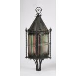 Ecclesiastical style hanging lantern, with a cone top above fleur de lis finials above the