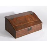 18th Century oak desk box, the sloping fall opening to reveal storage space above the panel base,