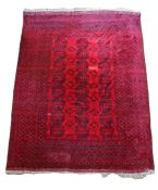 A Pakistan carpet, with red field and geometric design, 420cm long, 320cm wide