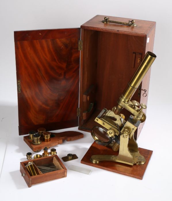 19th Century brass microscope, with three objectives and two eye pieces, housed in a mahogany case