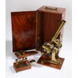 19th Century brass microscope, with three objectives and two eye pieces, housed in a mahogany case