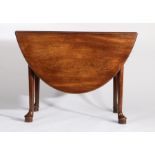 George III mahogany drop leaf dining table, the circular drop leaf top above tapering legs and pad